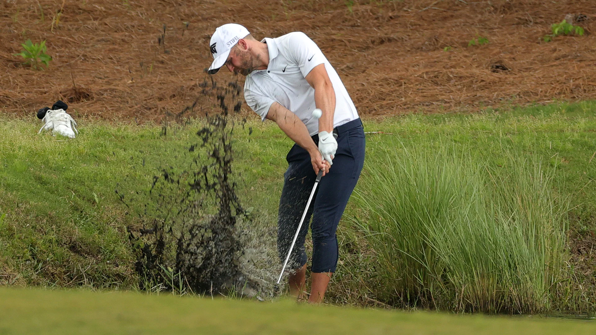 Watch: Wyndham Clark plays shot from alligator-infested waters