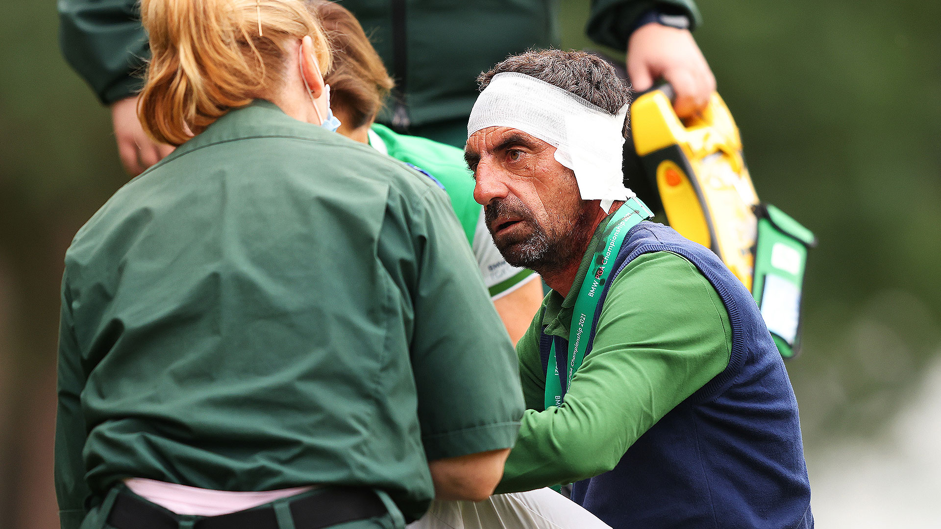 Errant shot by Francesco Laporta hits swing coach in the head