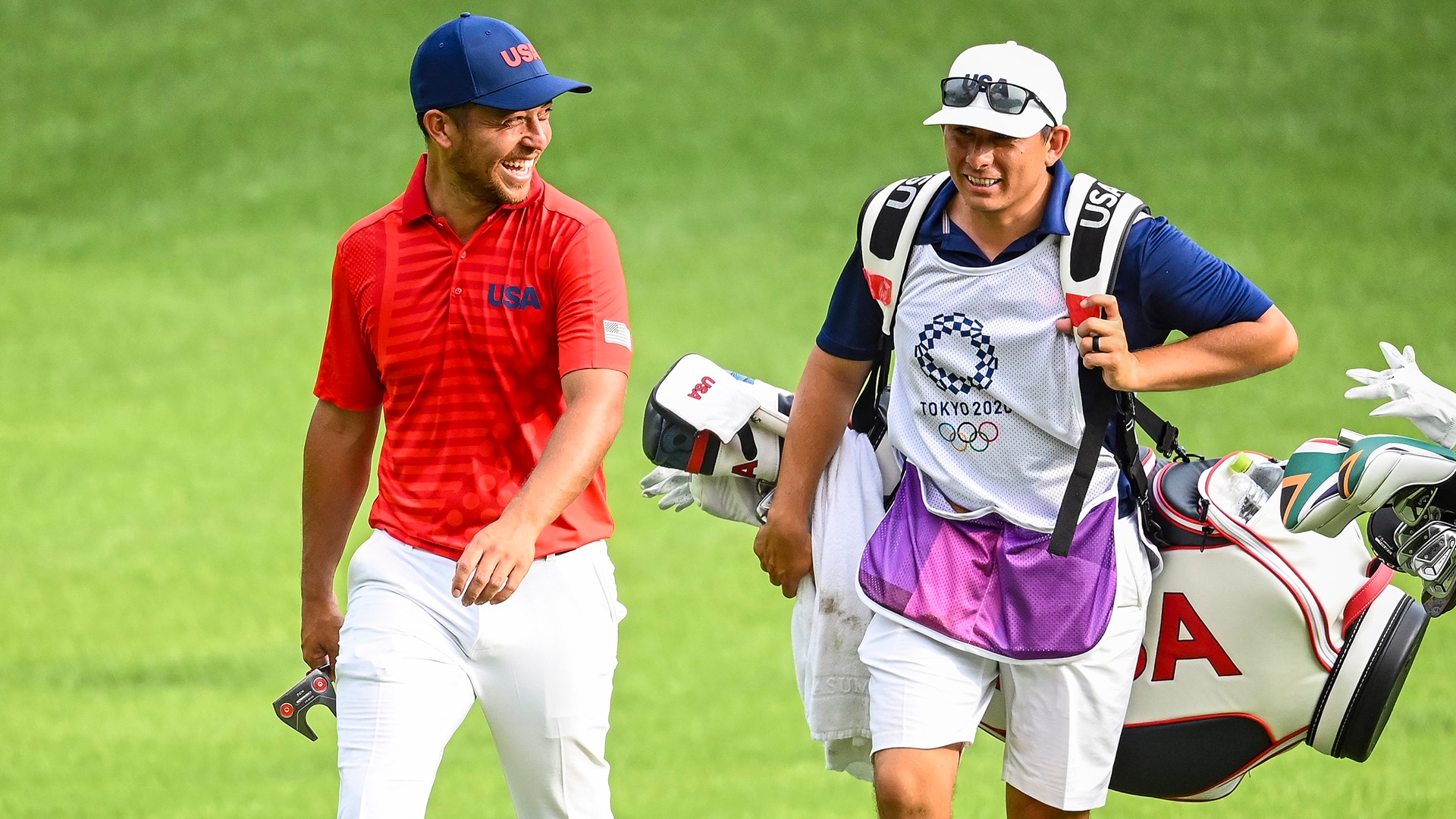 Xander Schauffele and his family gift caddie Austin Kaiser an Olympic ring