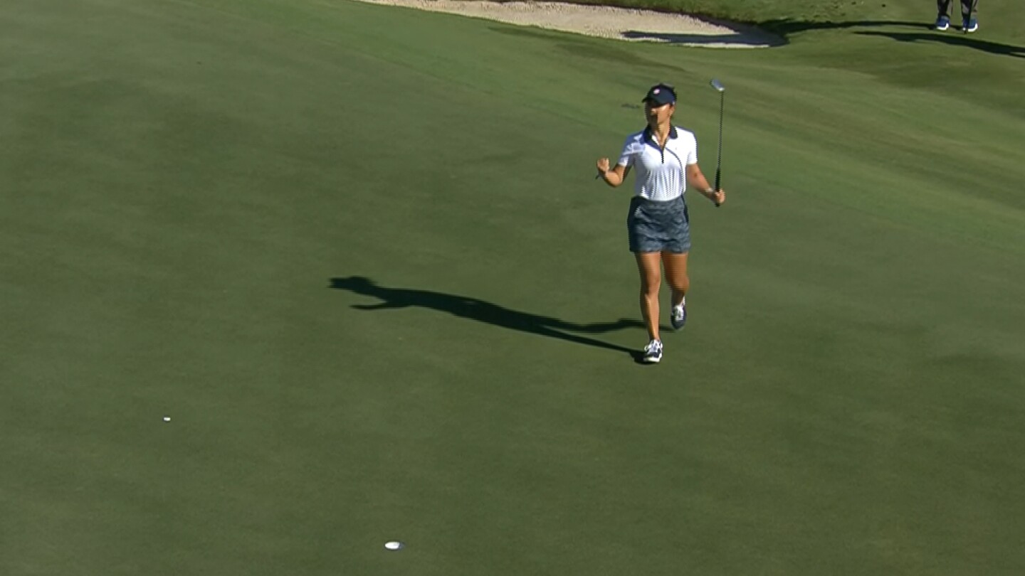 Danielle Kang fist pumps a birdie to pull all square at the turn on Day 2