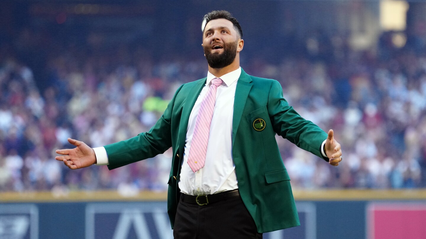 Watch: Jon Rahm, in green jacket, throws out first pitch at World Series