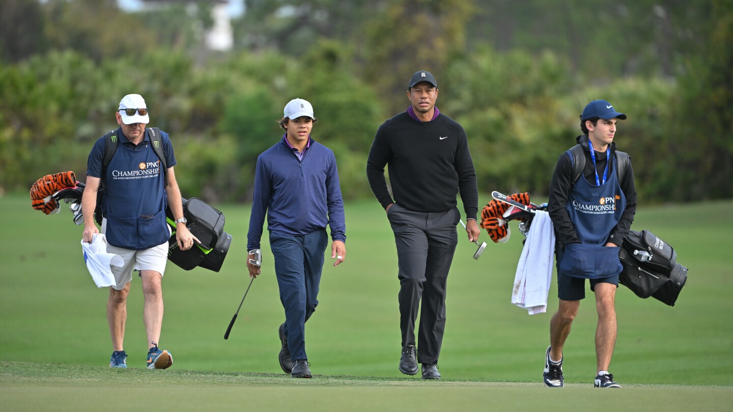 Tiger gets perfect caddie for family affair at PNC Championship.