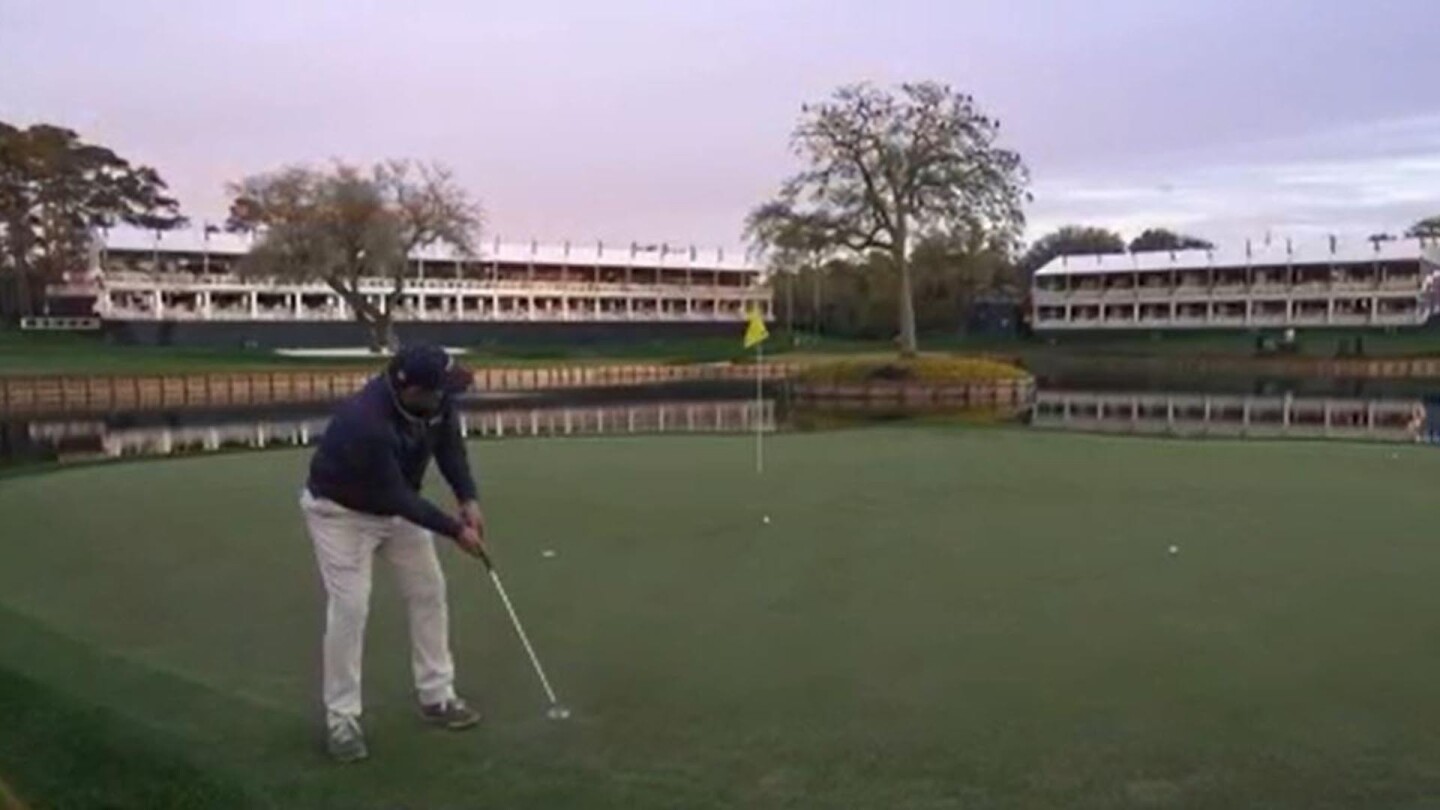 Johnson Wagner inspects the ‘famous’ 17th on TPC Sawgrass’ Stadium Course
