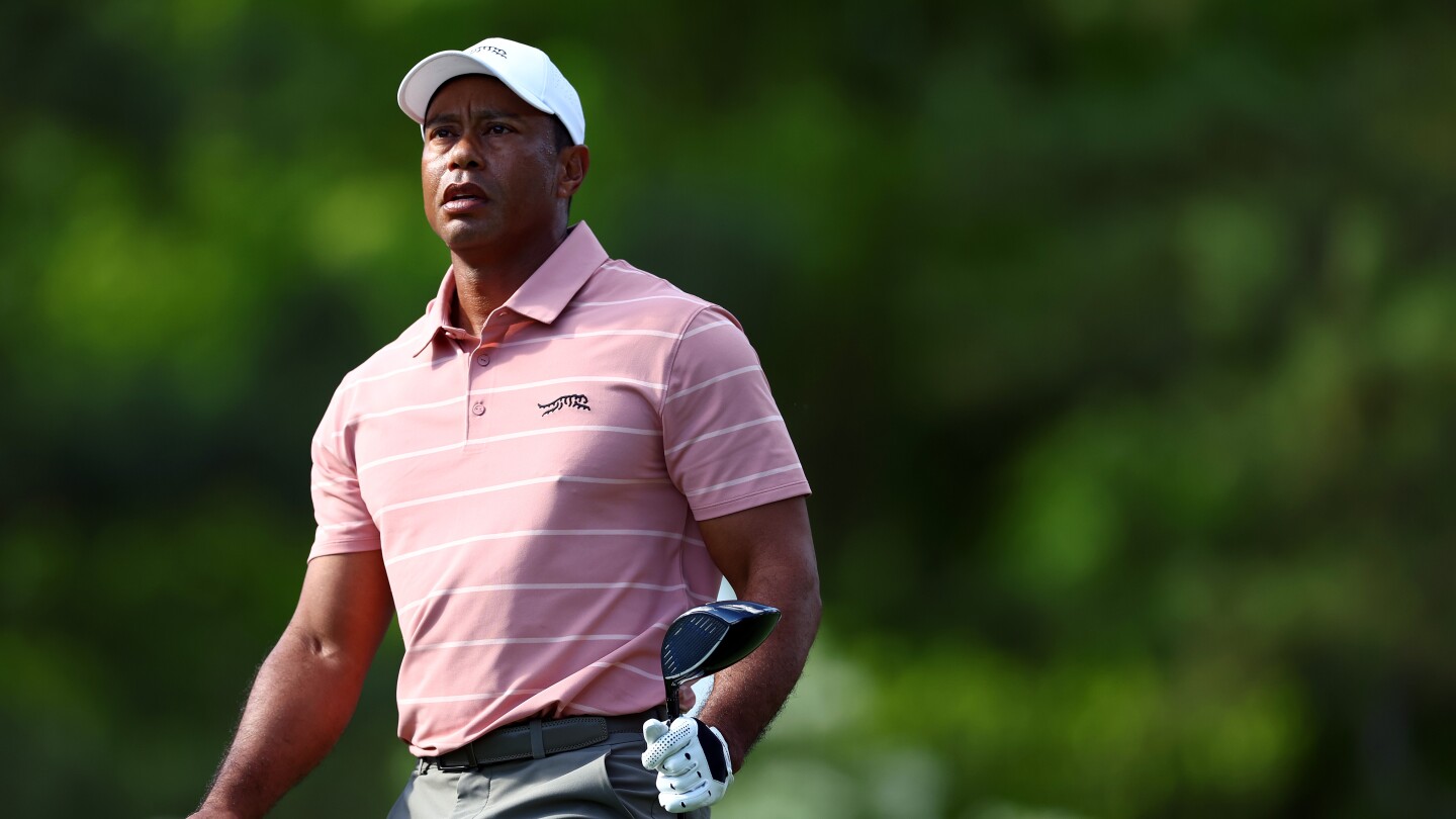 Tiger Woods under par as Masters first round halted for darkness
