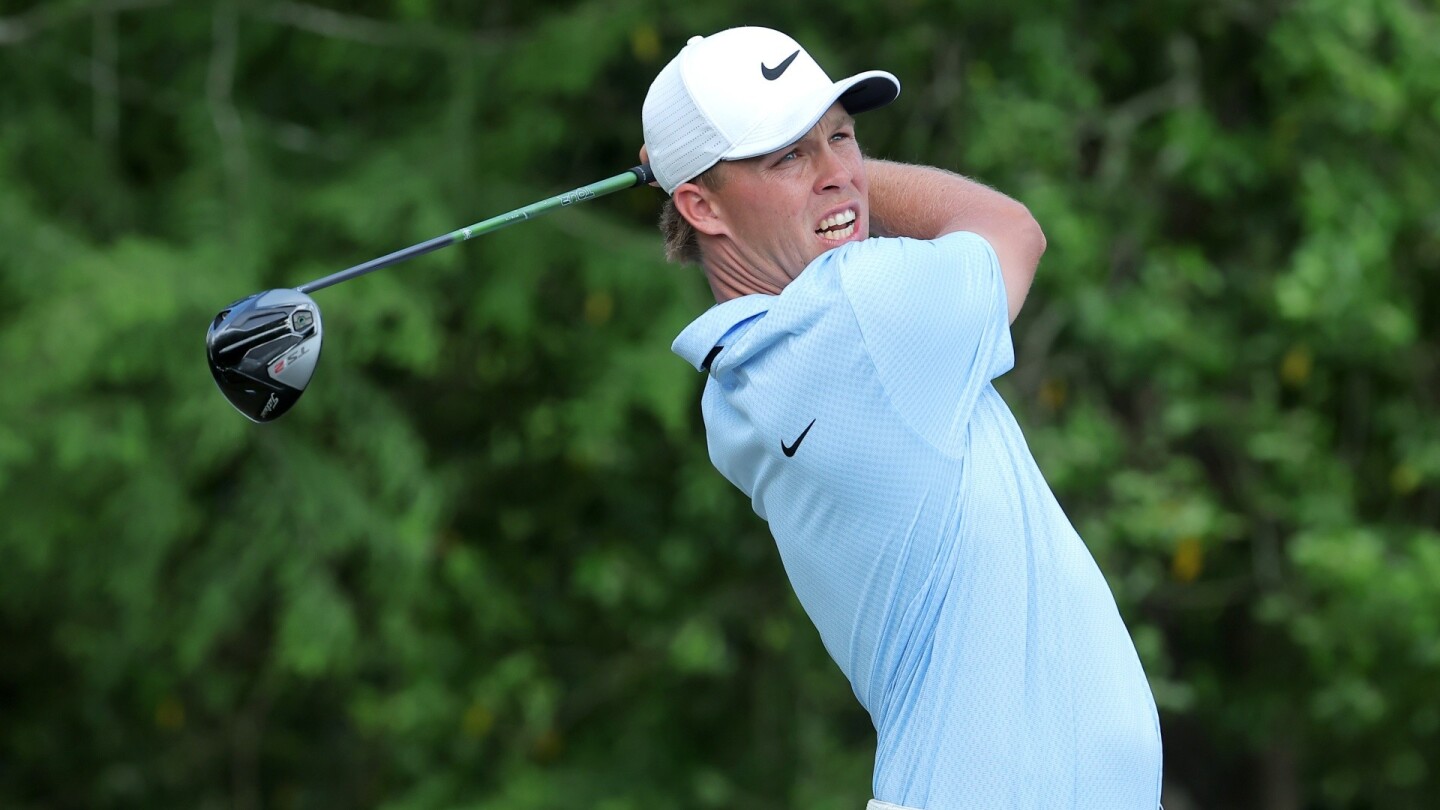 Nick Hardy holes out for the albatross at Butterfield Bermuda Championship