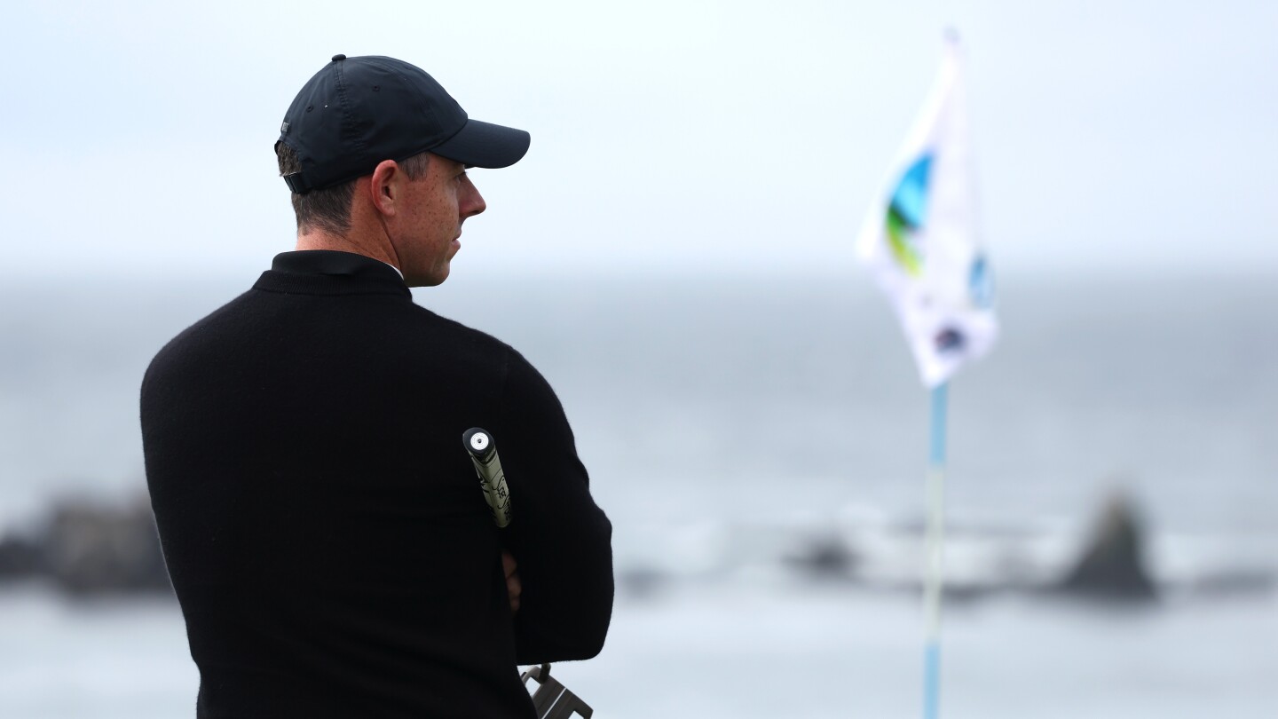 Rory McIlroy, Shane Lowry chasing Sepp Straka after windy, rainy day at Pebble Beach